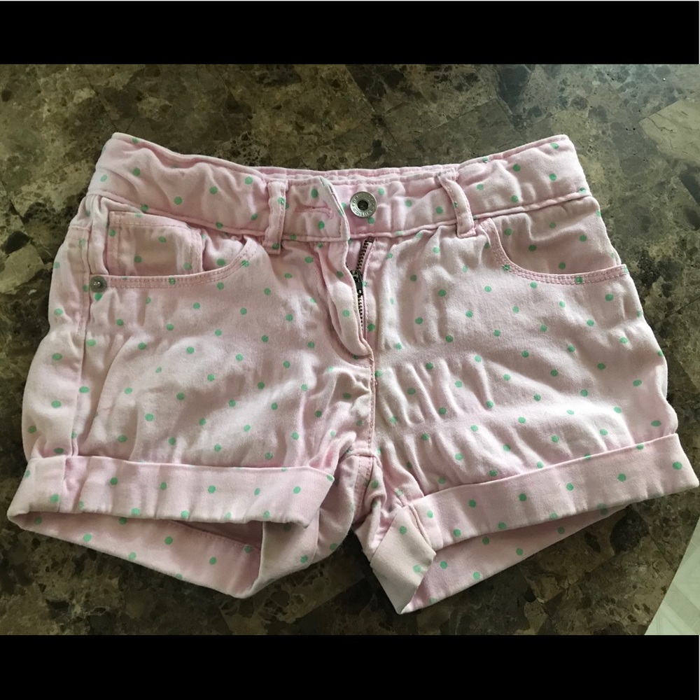 Pink shorts with green polka dots